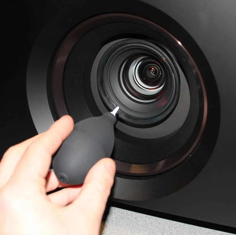 Cleaning projector lens